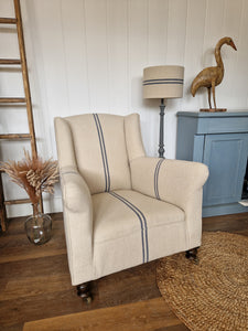 reupholstered 19th century chair, upholstered in grain sack fabric in cream colour with two blue stripes down the centre. 